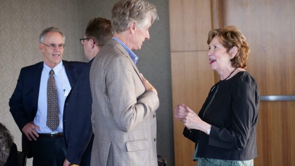 CU Denver Chancellor Dorothy Horrell networks with Graham A. Davis, Faculty Fellow and Professor at Colorado School of Mines. CU Denver Business School Interim Dean Dr. Gary Colbert looks on. 
