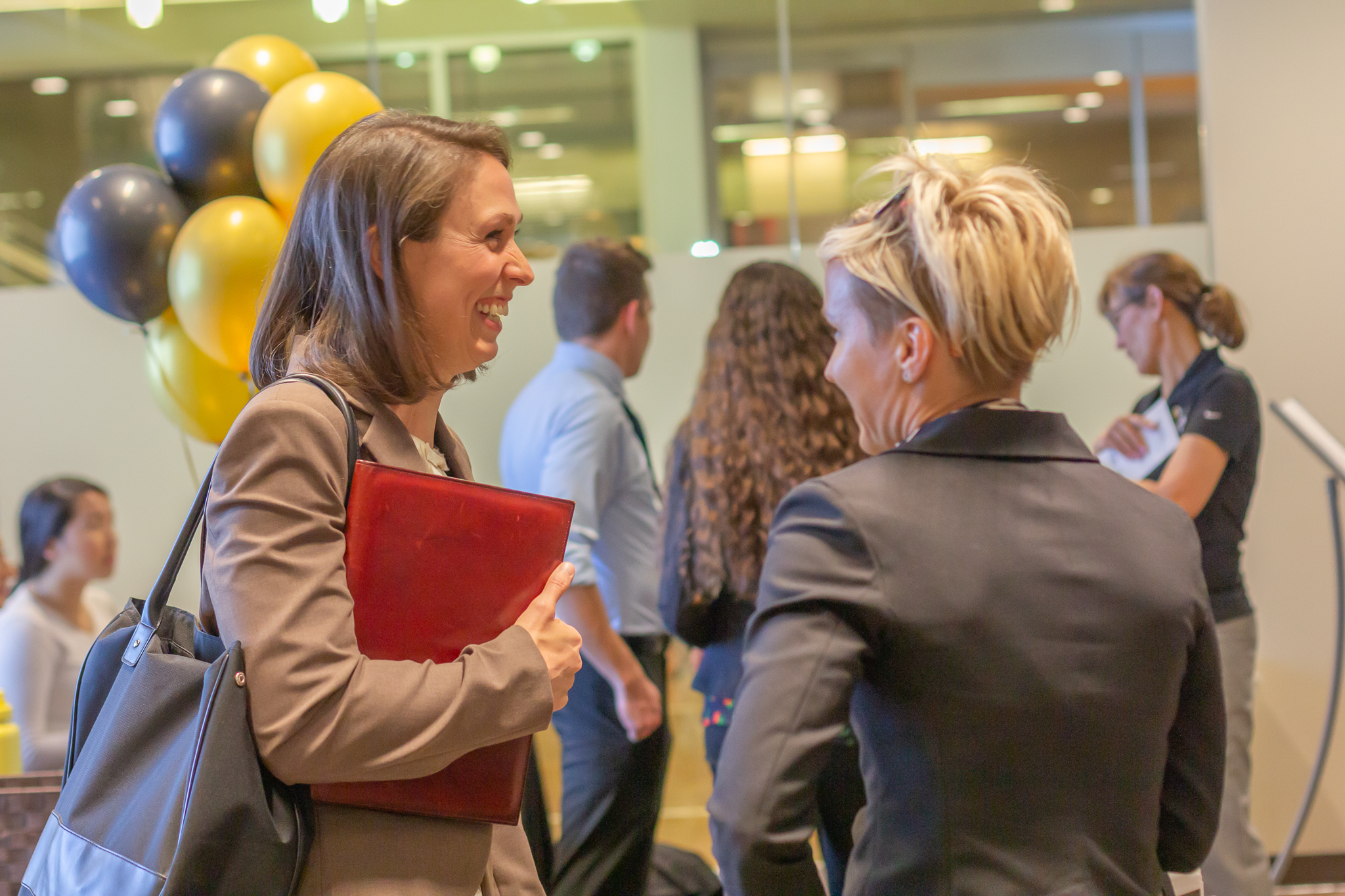 Student laughing with employer