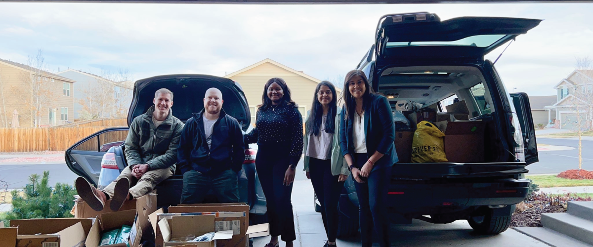 Students getting an MBA preparing boxes to deliver to those in need.